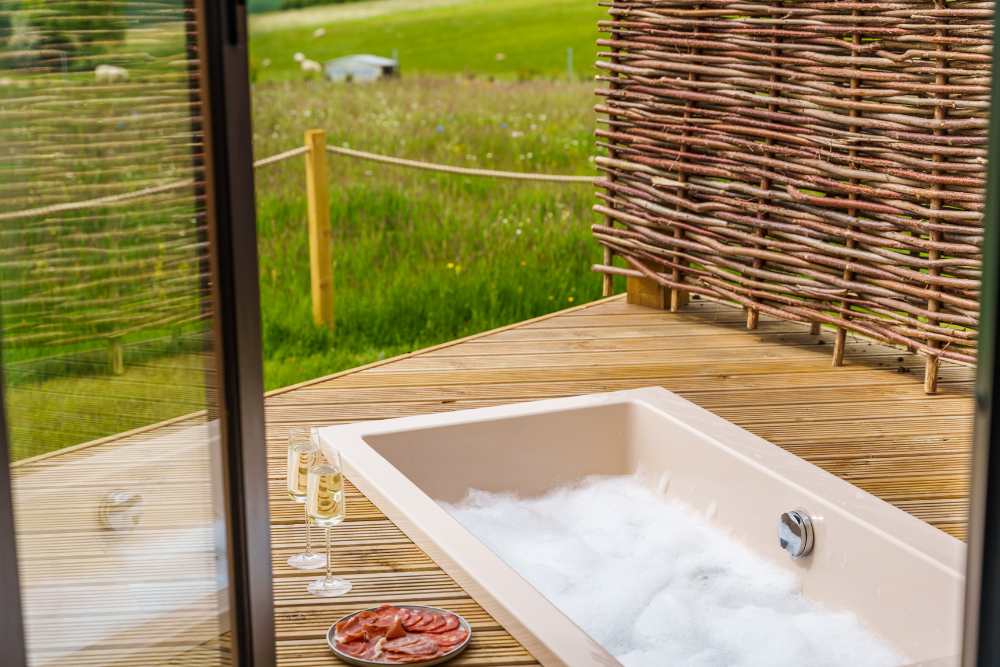 Outdoor bath in luxury glamping pod